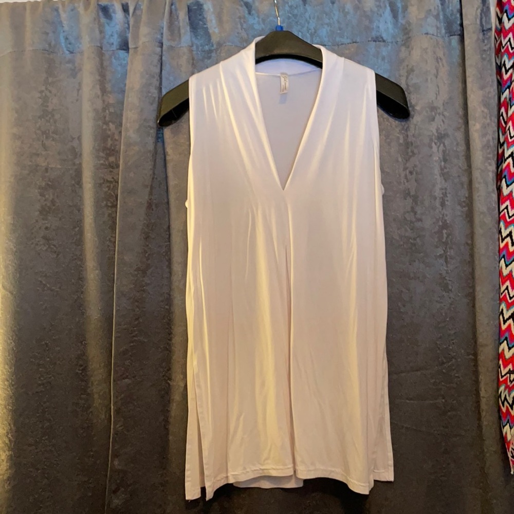 A white summer top, by Gilmore size small, also fits a medium.